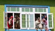 Kashmir women react as they watch the body of Nasir Ahmad, a suspected separatist militant, during his funeral procession after he was killed in a gun battle with Indian soldiers, in Arwani village in Anantnag district October 16, 2019. Reuters/Danish Ism