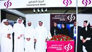 Commercial Bank officials posing for a picture on the sidelines of the event.