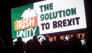 Demonstrators from 'Border Communities Against Brexit' attend an anti-No Deal Brexit protest at the Carrickcarnon border crossing on the road between Dundalk, Ireland on October 16, 2019, and Newry in Northern Ireland. / AFP / Paul Faith