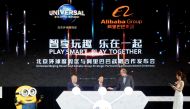 Chairman of Beijing Tourism Group Duan Qiang, Alibaba Group CEO Daniel Zhang and Comcast Corporation CEO Brian Roberts (L-R) attend a ceremony marking the announcement of a partnership between Universal Beijing Resort and Alibaba Group to create a theme p