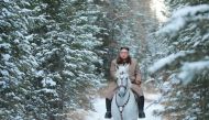 This undated picture released by Korean Central News Agency on October 16, 2019 shows North Korean leader Kim Jong Un riding a white horse amongst the first snow at Mouth Paektu. AFP