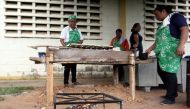Volunteers help to prepare the meal for students at the San Agustin school in La Canada de Urdaneta, Venezuela October 1, 2019. Reuters/Jose Nunes