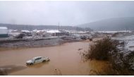 This handout picture released by the Russian Emergency Situations Ministry on October 19, 2019, shows a flooding after a dam failure in a gold miners village close to the town of Shchetinkino, about 250 km from the city of Krasnoyarsk. AFP PHOTO / RUSSIAN