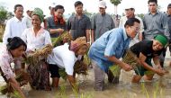 Hun Sen planting rice in 2008. He styles himself as a humble leader of a party representing ordinary Cambodians. Reuters