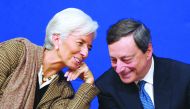 In this file photo, former International Monetary Fund (IMF) Managing Director Christine Lagarde talks with European Central Bank (ECB) President Mario Draghi during the “Treasury Talks” at French Economy and Finances Ministry. Mario Draghi’s final meetin