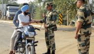 Border Security Force (BSF) personnel check identity documents of motorcyclists at Dera Baba Nanak, some 50 kms from Amritsar on October 24, 2019. AFP / NARINDER NANU