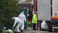 British Police forensics officers work on lorry, found to be containing 39 dead bodies, at Waterglade Industrial Park in Grays, east of London, on October 23, 2019. AFP / Ben Stansall
 
