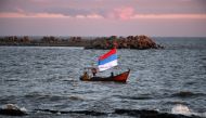 Supporters of the ruling Frente Amplio (Broad Front) party sail a boat during a campaign closing rally in Montevideo, on October 23, 2019, ahead of the October 27 general election. AFP / Pablo Porciuncula  