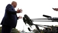 FILE PHOTO: U.S. President Donald Trump speaks to reporters as he departs for travel to South Carolina, at the South Lawn of the White House in Washington, U.S., October 25, 2019. REUTERS/Tom Brenner
