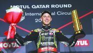 British racing star Jonathan Rea celebrates on the podium after winning the last race of the 2019 WorldSBK Championship at the Losail International Circuit yesterday.