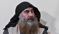 In this file photo taken on April 30, 2019 In this undated tv grab taken from a video released by Al-Furqan media, the chief of the Islamic State group Abu Bakr al-Baghdadi purportedly appears for the first time in five years in a propaganda video in an u