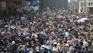 Pro-democracy protesters attend a rally in the Tsim Sha Tsui district in Hong Kong on October 27, 2019.  AFP / Philip FONG