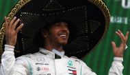 Mercedes' British driver Lewis Hamilton celebrates at the podium after winning the F1 Mexico Grand Prix, at the Hermanos Rodriguez racetrack in Mexico City on October 27, 2019.  AFP / PEDRO PARDO