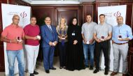 The Golden Summer Winners with Commercial Bank officials.