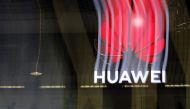 In this file photo taken on October 15, 2019 an illuminated Huawei sign is on display during the 10th Global mobile broadband forum hosted by Huawei in Zurich