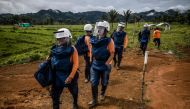 FARC-EP ex-combatant Edwin Correa (2-L) and former fellow fighters take part in a humanitarian demining training in the municipality of La Montanita, Caqueta, Colombia, on October 9, 2019. AFP / Juan Barreto 
