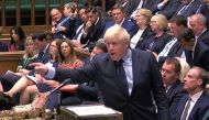 A video grab from footage broadcast by the UK Parliamentary Recording Unit shows Prime Minister Boris Johnson gestures toward the opposition benches on September 3, 2019.