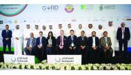 The organisers and delegates of the Qatar Sustainability Summit, posing for a photograph with  Qatar Football Association and Qatar Stars League officials.
