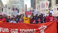 Teachers and supporters march, days before the teacher's union was set to go on strike if a contract settlement was not reached, in Chicago, Illinois, U.S. October 14, 2019. Reuters/Brendan O'Brien
 
 