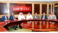 QIIB Deputy CEO Jamal Abdullah Al Jamal (centre) and other officials at the workshop held to discuss cyber-security related issues and challenges, yesterday. 