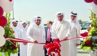 Commercial Bank Board Member, Sheikh Faisal bin Fahad bin Jassim Al Thani (foreground, right), formally opening the bank’s Ain Khaled branch as President and CEO of Milaha, Abdulrahman Al Mannai (foreground, left), and other officials look on. 