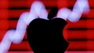 FILE PHOTO: A 3D printed apple logo is seen in front of a displayed stock graph in this illustration taken February 26, 2016. REUTERS