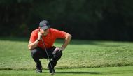 Rory McIlroy of Northern Ireland lines up a putt during the second round of the WGC-HSBC Champions golf tournament in Shanghai on November 1, 2019. AFP / HECTOR RETAMAL