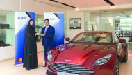 Heba Al Tamimi, General Manager, QNB Group Retail, giving away the grand prize to the winner Abraham Benjamin Pavutheril.