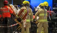 Paramedics carry away a wounded person on a stretcher after a bloody knife fight broke out at a shopping mall in Hong Kong on November 3, 2019.  AFP / VIVEK PRAKASH