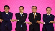 (From L to R) Japan's Prime Minister Shinzo Abe, China's Premier Li Keqiang, Thailand's Prime Minister Prayut Chan-O-Cha and South Korea's President Moon Jae-in pose for a group photo during the 22nd ASEAN Plus Three Summit in Bangkok on November 4, 2019,