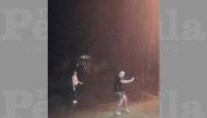 Men dance in the rain as they celebrate the first rainfall following a drought in Bourke, New South Wales, Australia November 2, 2019 in this picture obtained from social media. THE PORT OF BOURKE HOTEL/via REUTERS