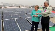 German Chancellor Angela Merkel speaks with an officer during her visit to a solar-powered metro station at Dwarka in New Delhi, India, November 2, 2019. Reuters/Andreas Rinke