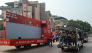 A vehicle equipped with an air purifier by Agra's Municipal Corporation and Agra Smart City in collaboration with a telecoms company is seen parked outside the Taj Mahal as tourists visit the site under heavy smog conditions in Agra on November 4, 2019. A
