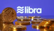 Representations of virtual currency are displayed in front of the Libra logo in this illustration picture, June 21, 2019. Reuters/Dado Ruvic