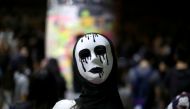 An anti-government protester wears a mask during a demonstration in Wong Tai Sin district, in Hong Kong, China October 4, 2019. Reuters / Athit Perawongmetha