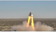 This NASA handout photo released November 4, 2019 shows Boeing’s CST-100 Starliner’s four launch abort engines and several orbital maneuvering and attitude control thrusters as they ignite in the company’s Pad Abort Test, pushing the spacecraft away from 