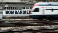 FILE PHOTO: A Bombardier advertising board is pictured in front of a Swiss train at the station in Bern, Switzerland, October 24, 2019. REUTERS/Denis Balibouse/File Photo