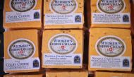 In this file photo taken on June 27, 2016 Colby cheese packages are offered for sale at Widmer's Cheese Cellars in Theresa Wisconsin. AFP / Getty Images North America / Scott Olson