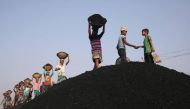Coal workers are seen at a market as they unload a ferry in Dhaka, Bangladesh, January 13, 2019. Reuters/Mohammad Ponir Hossain