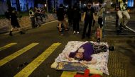 Anti-government protester lies on a mattress during a protest, following 22 year-old University student's fall and who was critically injured last weekend, in Tseung Kwan O, Hong Kong, China November 6, 2019. Reuters/Tyrone Siu