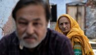 Zaibunissa, whose husband was killed during riots following the demolition of Babri Masjid, sits with her son Mohammed Shahid outside their house in Ayodhya, India, October 22, 2019. Reuters/Danish Siddiqui