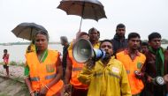 Cyclone Preparedness Programme (CPP) officials urge people to evacuate their homes in preparation for Cyclone Bulbul, in Khulna on November 9, 2019.  AFP