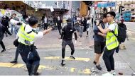 A still image from a social media video shows a police officer aiming his gun at a protester in Sai Wan Ho, Hong Kong, China November 11, 2019. CUPID PRODUCER via REUTERS