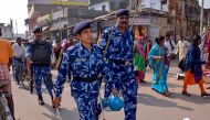 Rapid Action Force (RPF) personnel patrol on a street in Ayodhya on November 8, 2019, ahead of a Supreme Court verdict on the future of a disputed religious site. Indian police have arrested more than 500 people ahead of a Supreme Court ruling on a hotly 