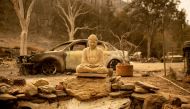 A Buddha statue is seen at a burned home in Spring Valley near Clearlake Oaks, northern California on August 7, 2018. AFP / Josh Edelson