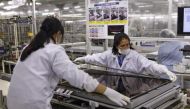 Women assemble an Aquos television at Sharp Corp Tochigi plant in Yaita, north of Tokyo, November 19, 2015. Reuters / Reiji Murai
 