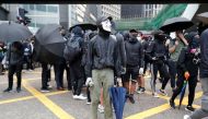 A demonstrator wears a Guy Fawkes mask during an anti-government protest in Central, Hong Kong, China November 12, 2019. REUTERS/Shannon Stapleton
