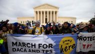 Demonstrators arrive in front of the US Supreme Court during the 