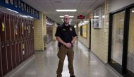 School resource officer, John Pence, who serves as an extra precaution to help keep students safe in the building, poses at Sidney High School in Sidney, Ohio, October 31, 2019. AFP / Megan Jelinger 