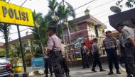 Indonesian police secure their headquarters in Medan, North Sumatra, on November 13, 2019, after a suicide attack occurred during their morning roll call. A suspected suicide bomber blew himself up outside a police station in Indonesia with at least one o